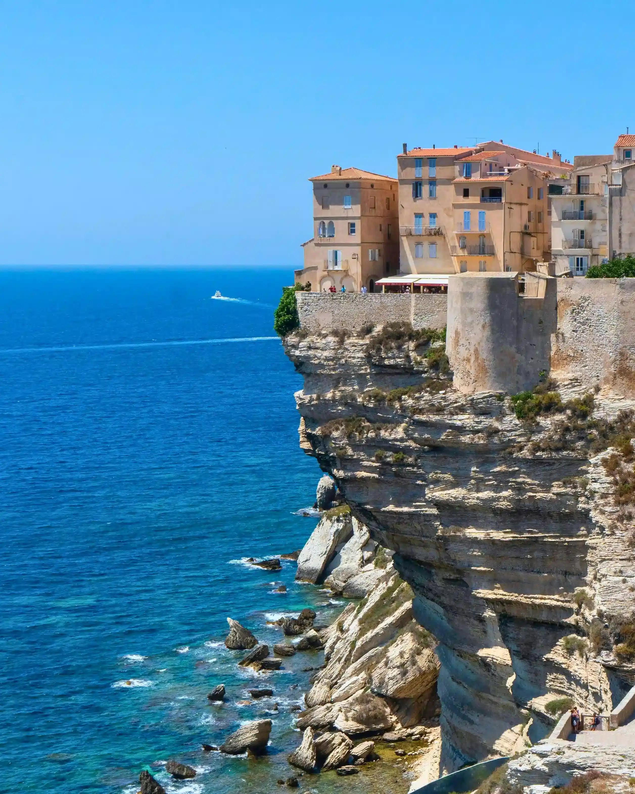 A village in Bonifacio near a body of water in France